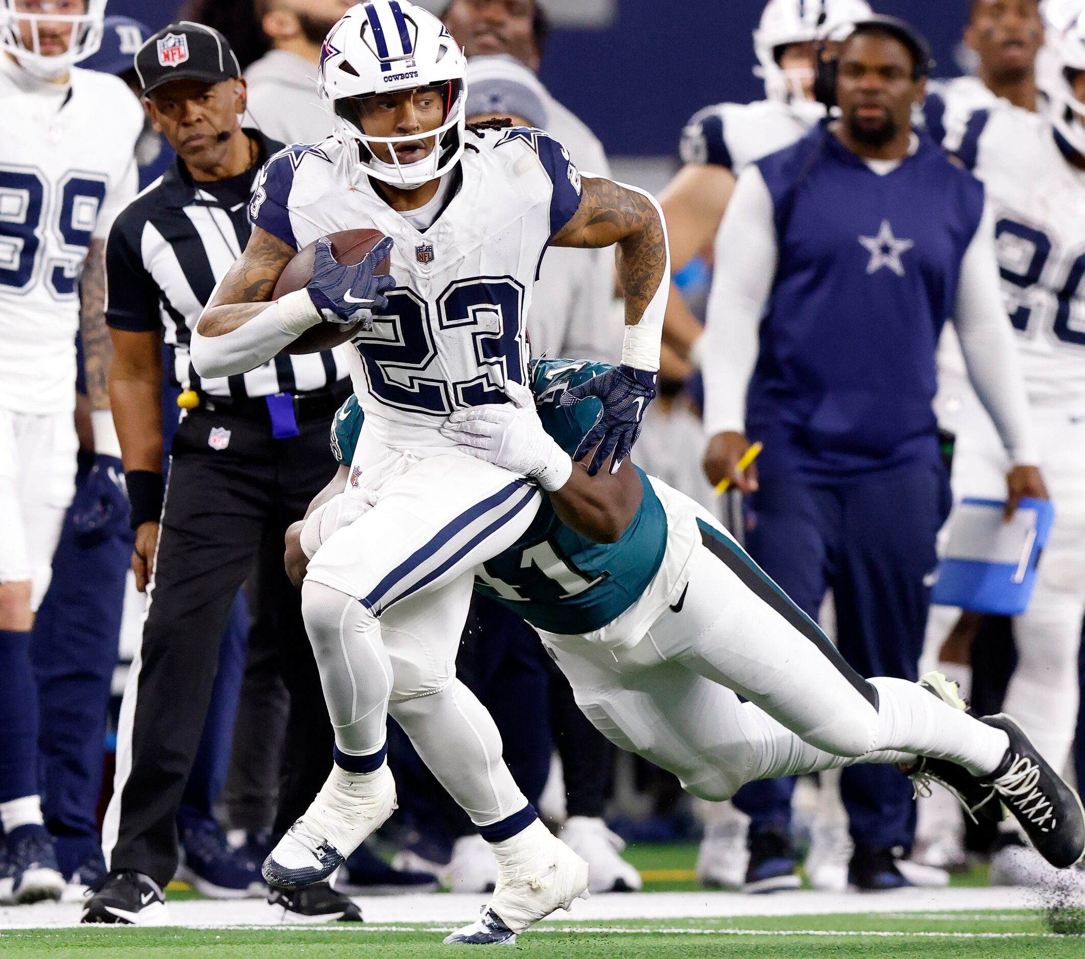 Dallas Cowboys running back Rico Dowdle (23) is tackled from behind by Philadelphia Eagles...