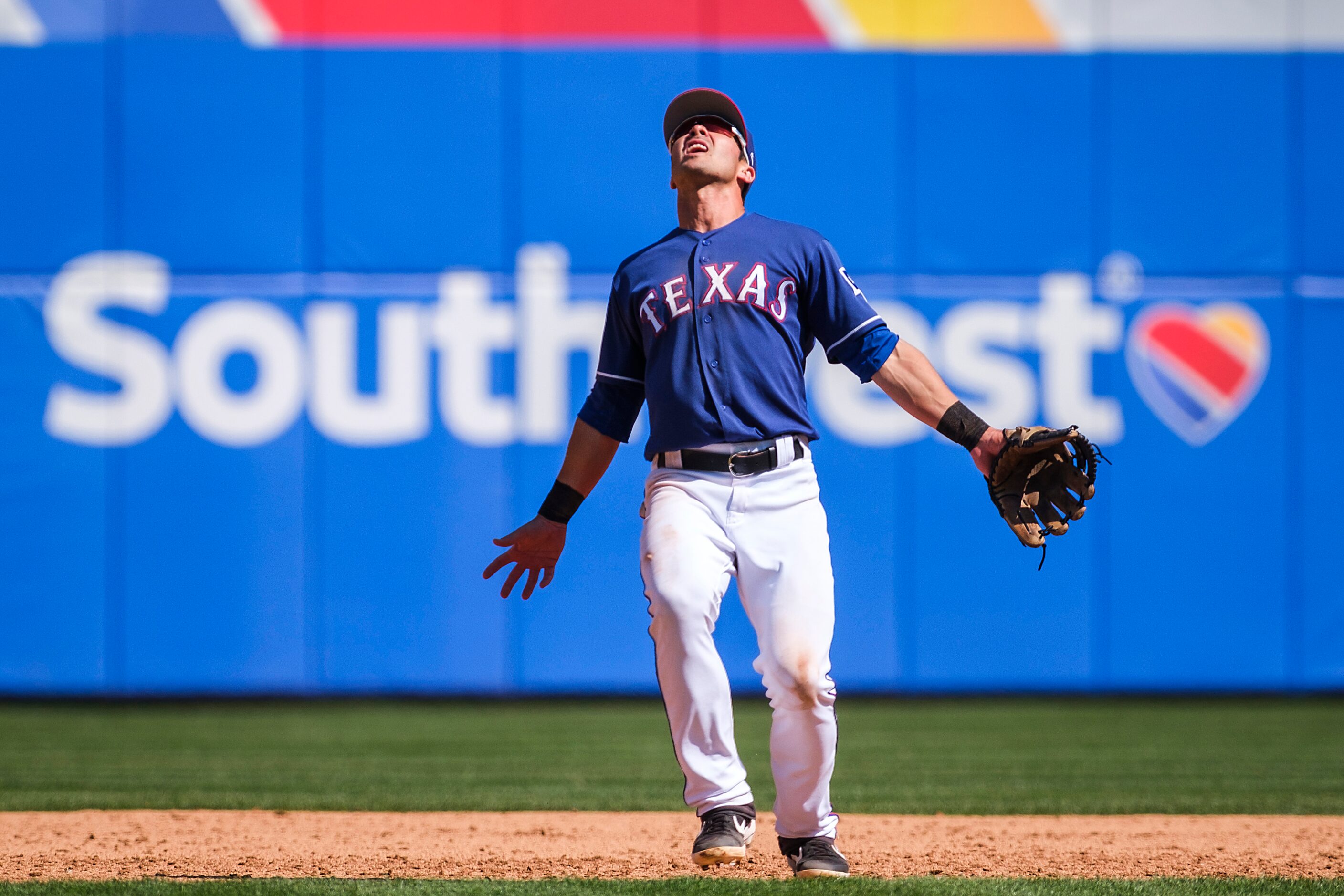 Texas Rangers infielder Chase d'Arnaud calls for a popup during the sixth inning of a spring...