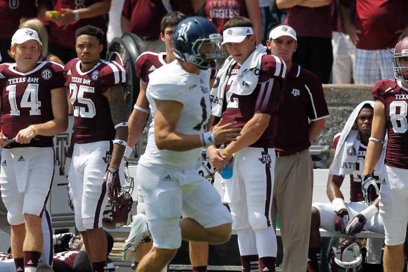 Texas A&M Aggies quarterback Johnny Manziel (2) watches from the sideline as Rice Owls wide...