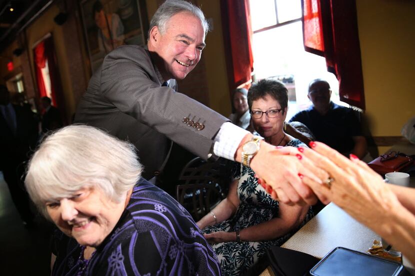 Sen. Tim Kaine, the Democratic nominee for vice president, reached to shake a woman's hand...