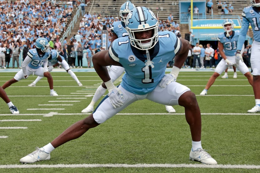 North Carolina defensive back Tony Grimes (1) stretches before an NCAA college football game...