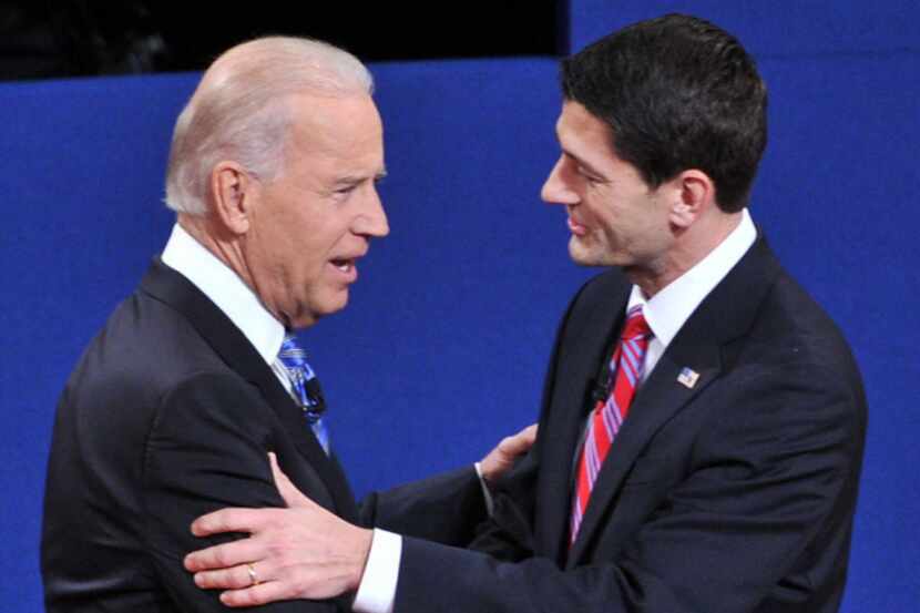 US Vice President Joe Biden (L) and Republican vice presidential candidate Paul Ryan shake...