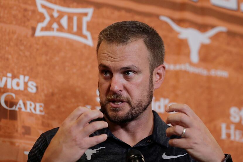 Texas head coach Tom Herman responds to a question during an NCAA college football news...