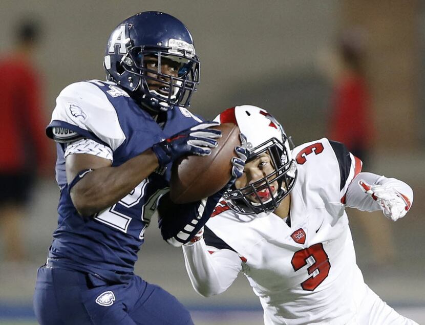 Allen's Colton Manning (24) intercepts a pass intended for Flower Mound Marcus' Michael...