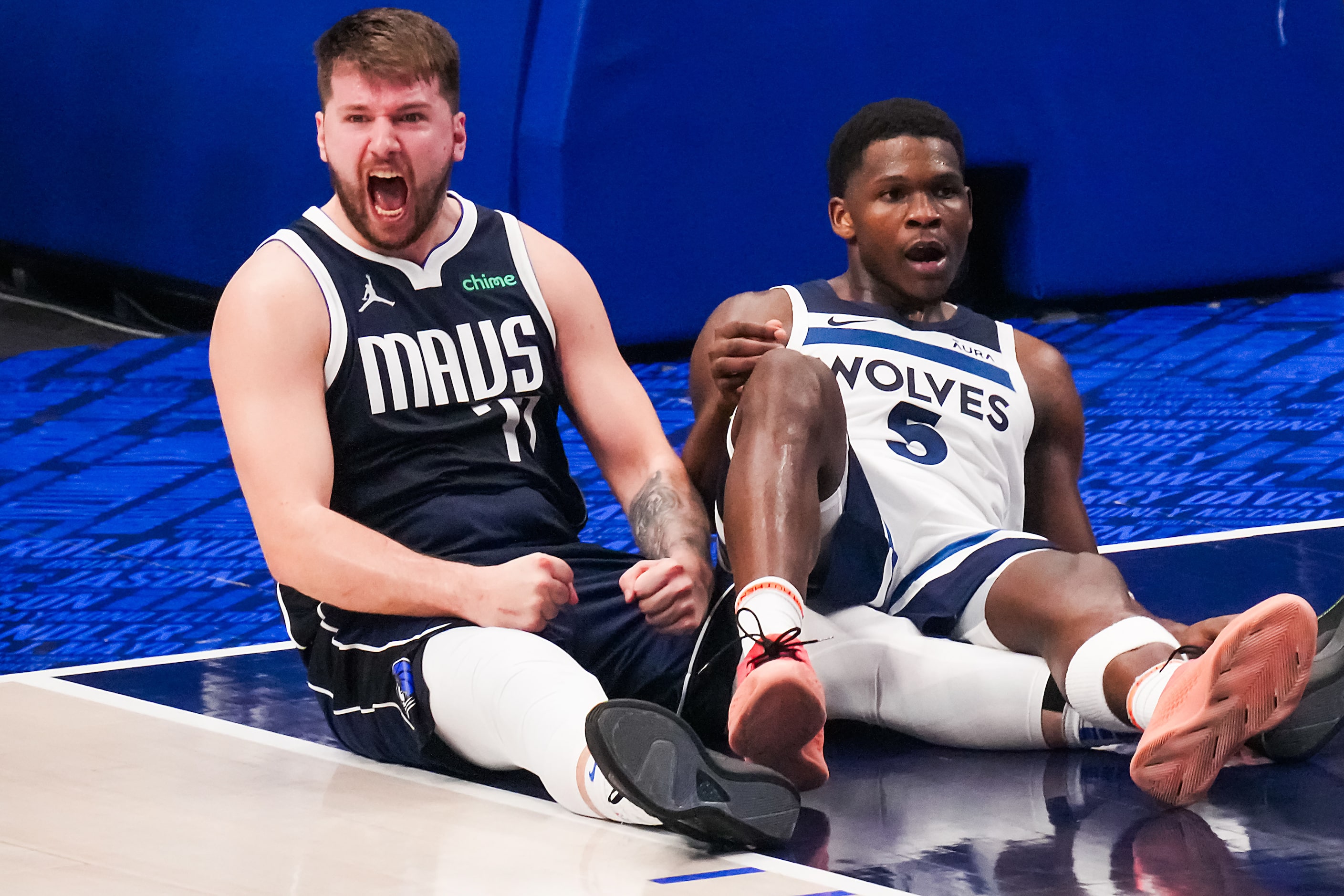 Dallas Mavericks guard Luka Doncic (77) celebrates after drawing a charge from Minnesota...