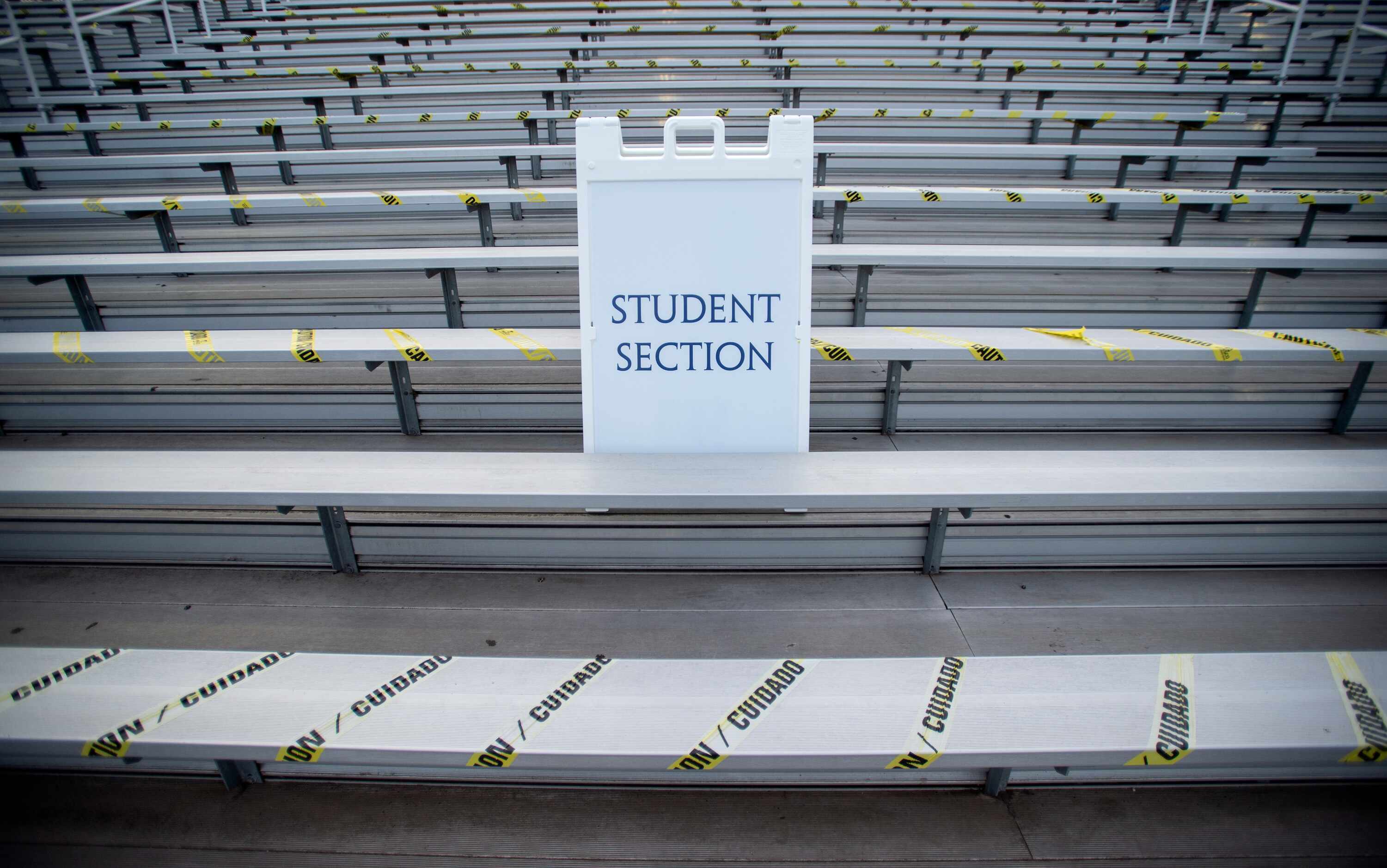 Alternating rows are blocked off in the student section of Postell Stadium before a high...