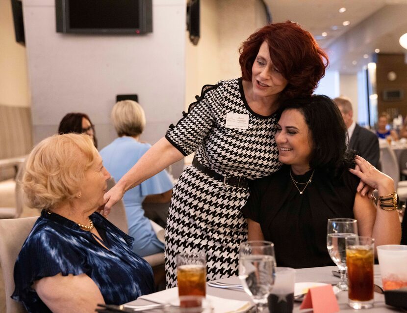 Operations manager Mona Harmon (center) greeted Realtor Betsy Davila (right) and her mother,...