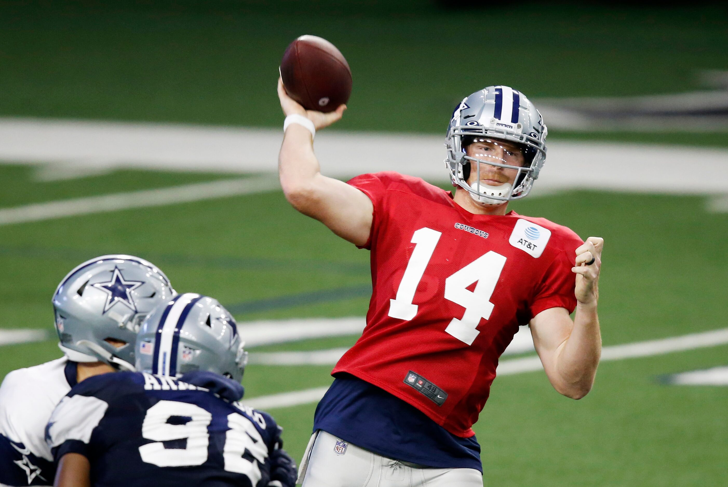 Dallas Cowboys quarterback Andy Dalton (14) attempts a pass during training camp inside the...