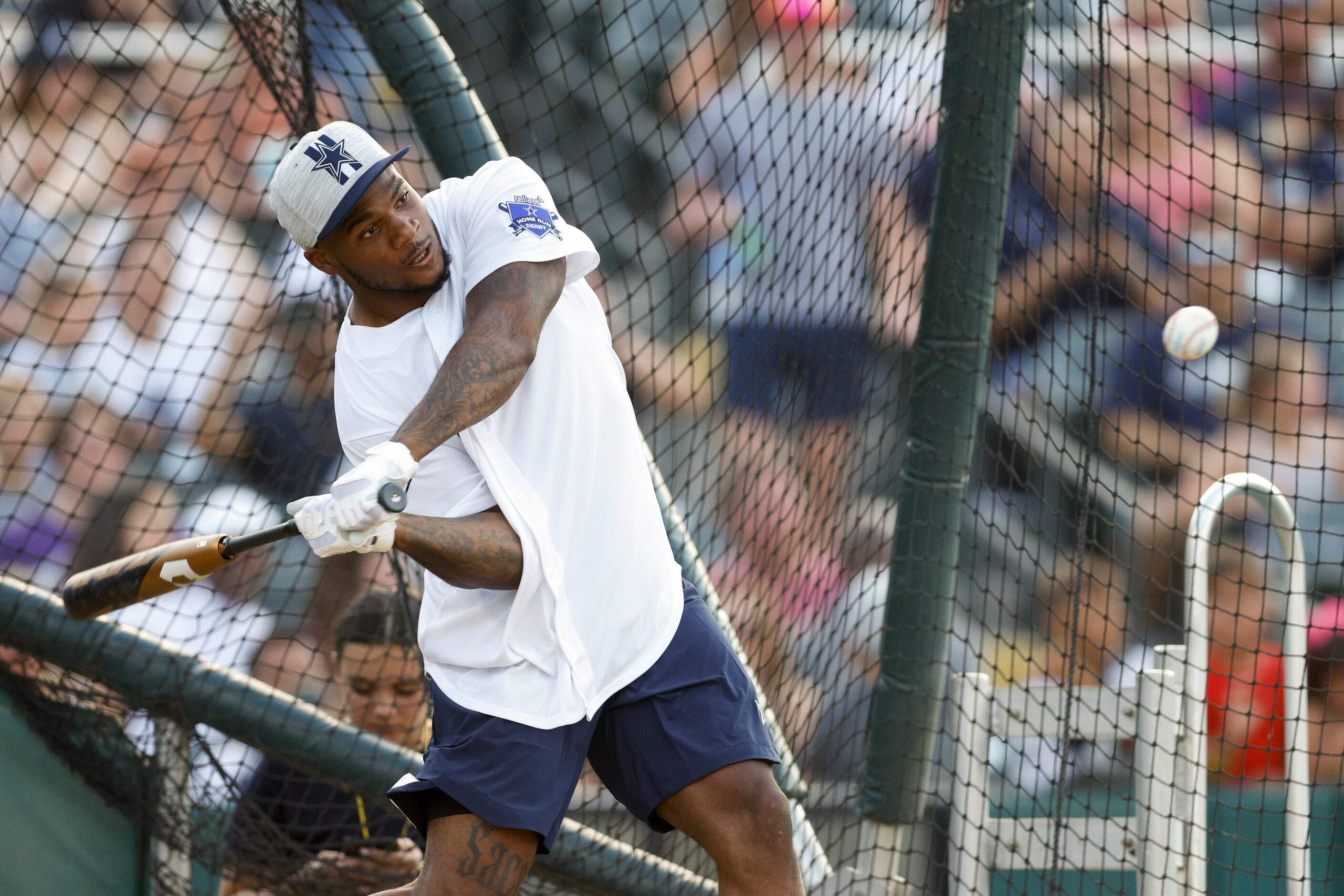 Dallas Cowboys linebacker Micah Parson hits the ball during the Reliant Energy Home Run...