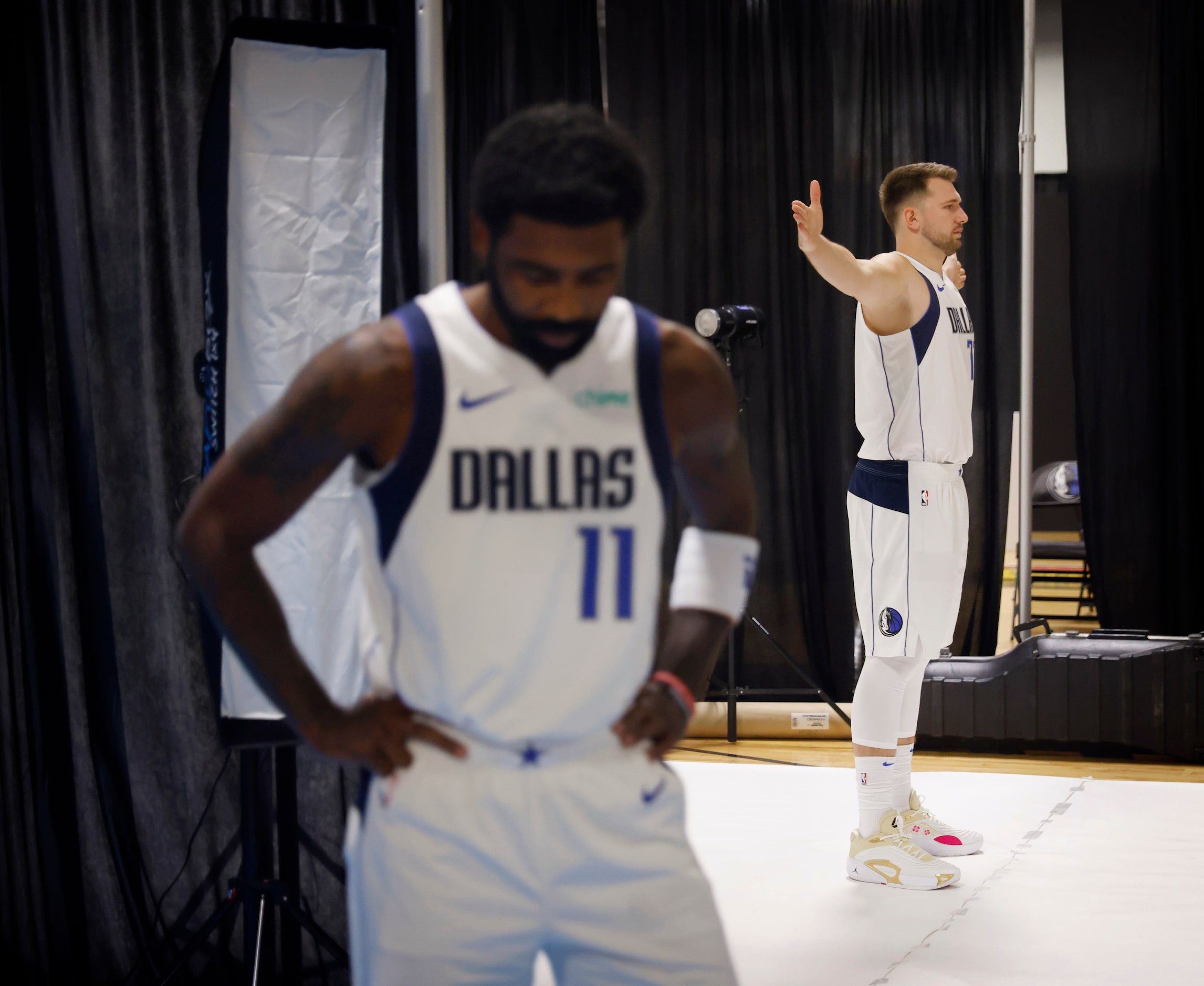 Dallas Mavericks guards Luka Doncic (77) and Kyrie Irving (11) pose for photos in...