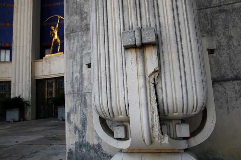 A missing chunk (lower right) of a column on the exterior of the Hall of State building at...