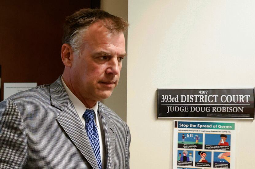 Former Texas Rangers pitcher John Wetteland left the courtroom in Denton after the judge...