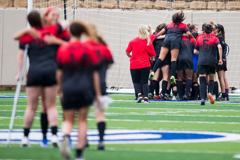 Mansfield Legacy players celebrate a 4-0 win after a UIL conference 5A girls state semifinal...