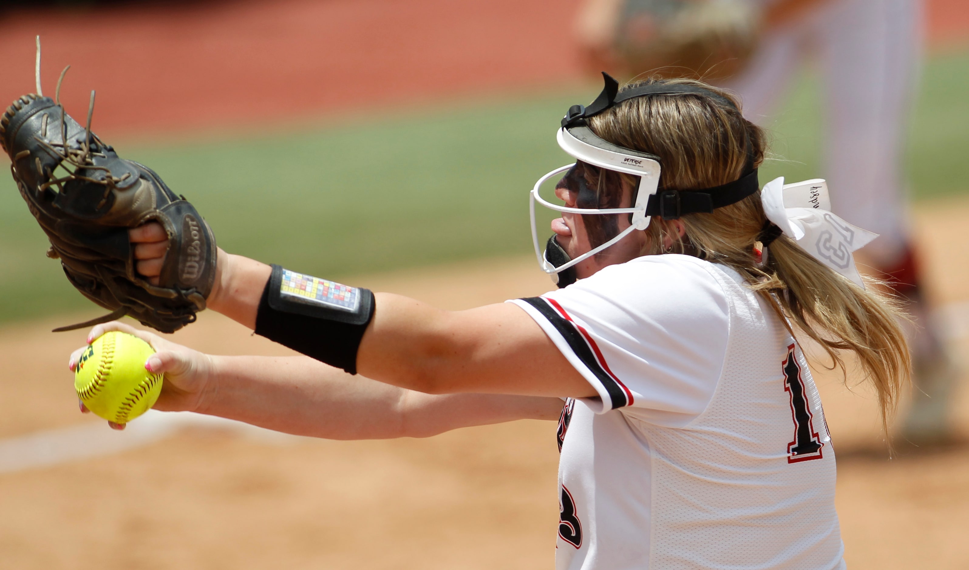 Colleyville Heritage pitcher Lindsey McConnell (13) delivers a pitch to a Comal Canyon...