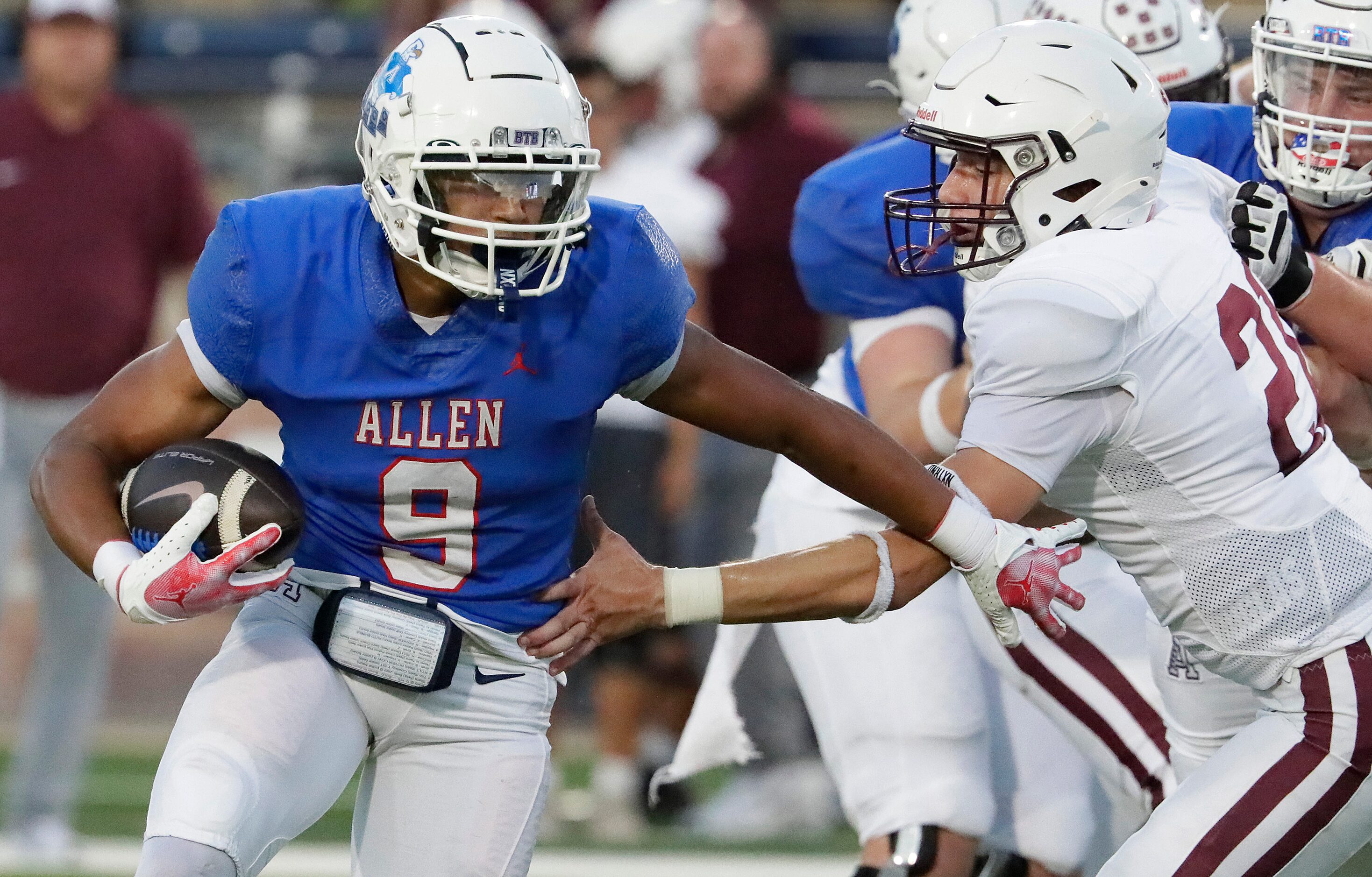 Allen High School wide receiver Brett Holloway (9) runs past Plano High School quarterback...