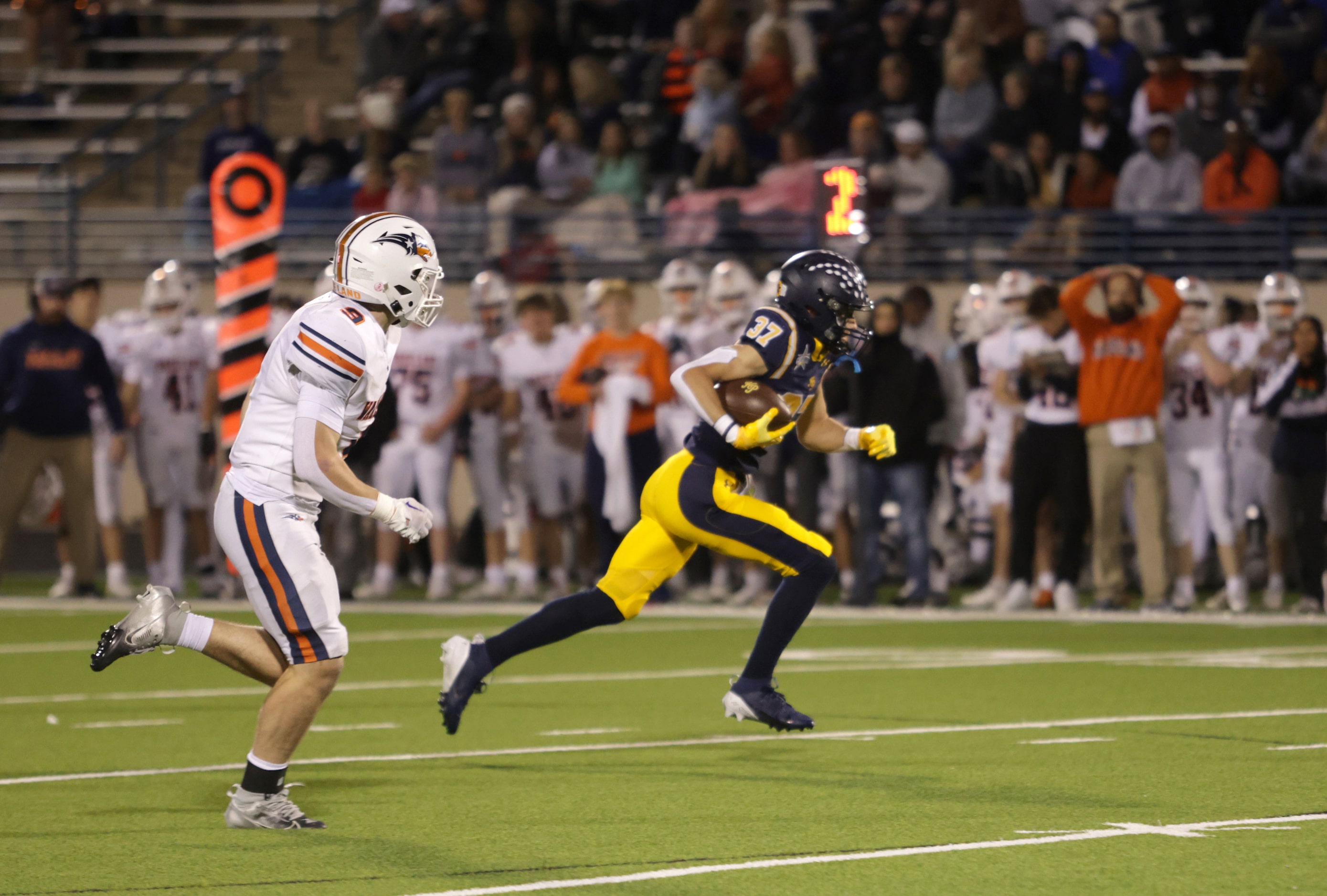 Highland Park's Cannon Bozman takes off in a football playoff game against Frisco Wakeland...