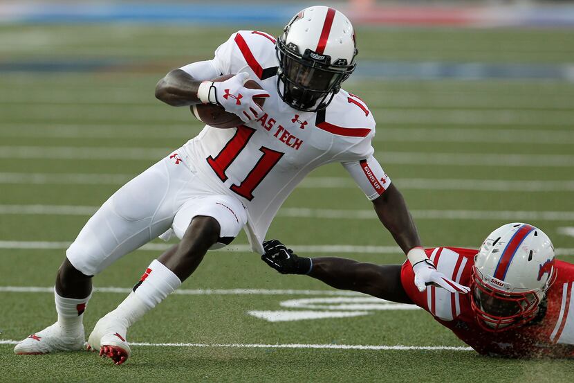 Texas Tech Red Raiders wide receiver Jakeem Grant (11) is dragged down by Southern Methodist...