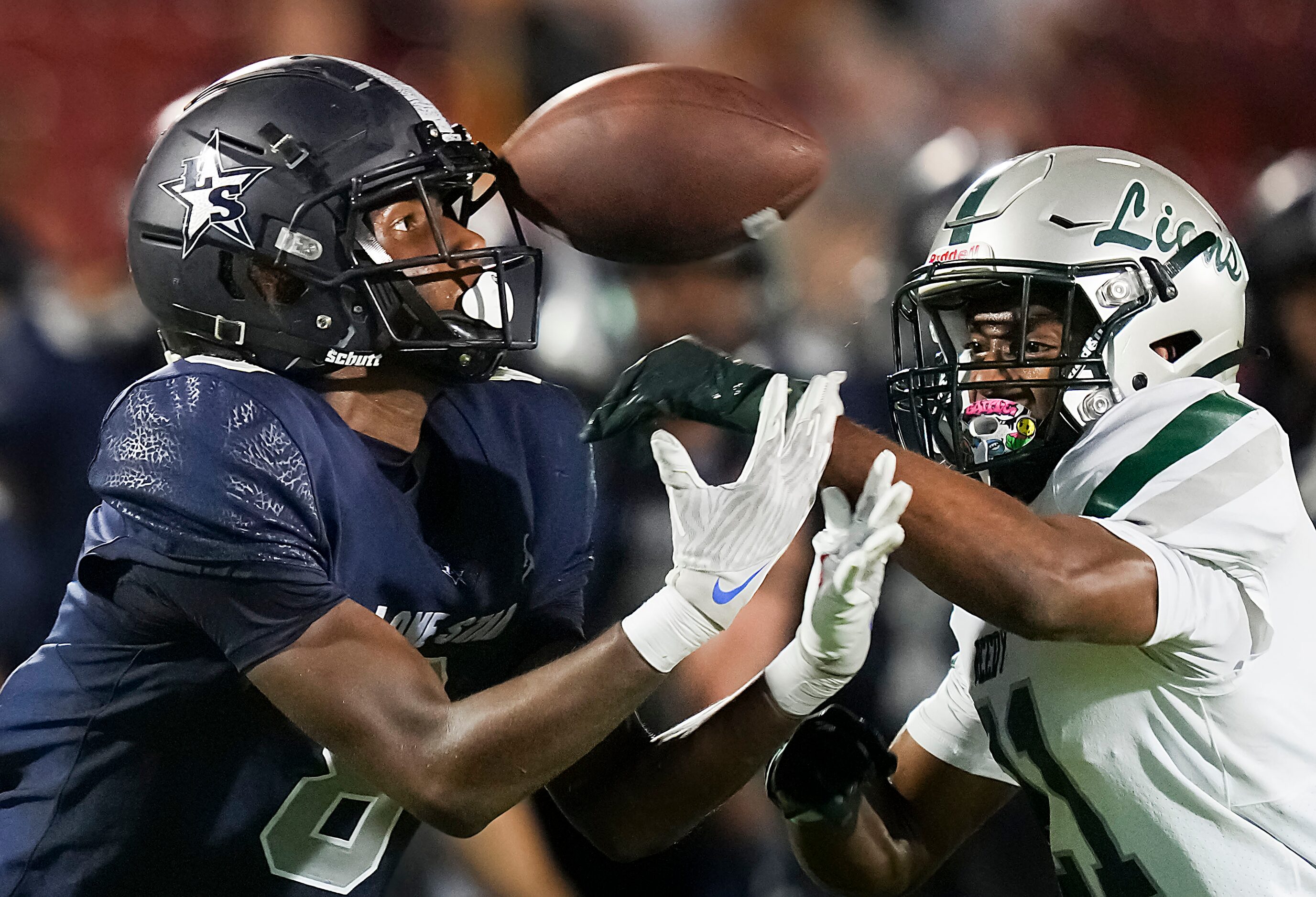 Frisco Lone Star wide receiver Winson Pollard (8) reaches for a pass as Frisco Reedy...