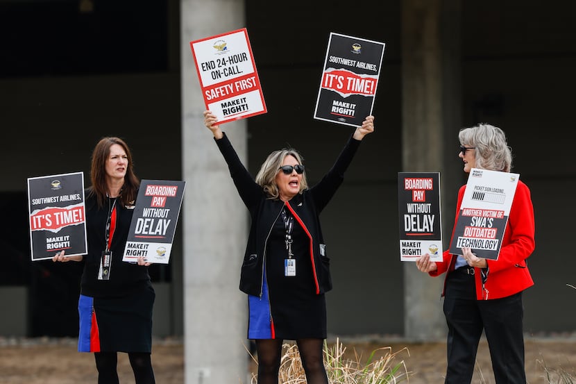 Southwest Airlines flight attendant Dixie Cunningham, center, during a picketing at the...