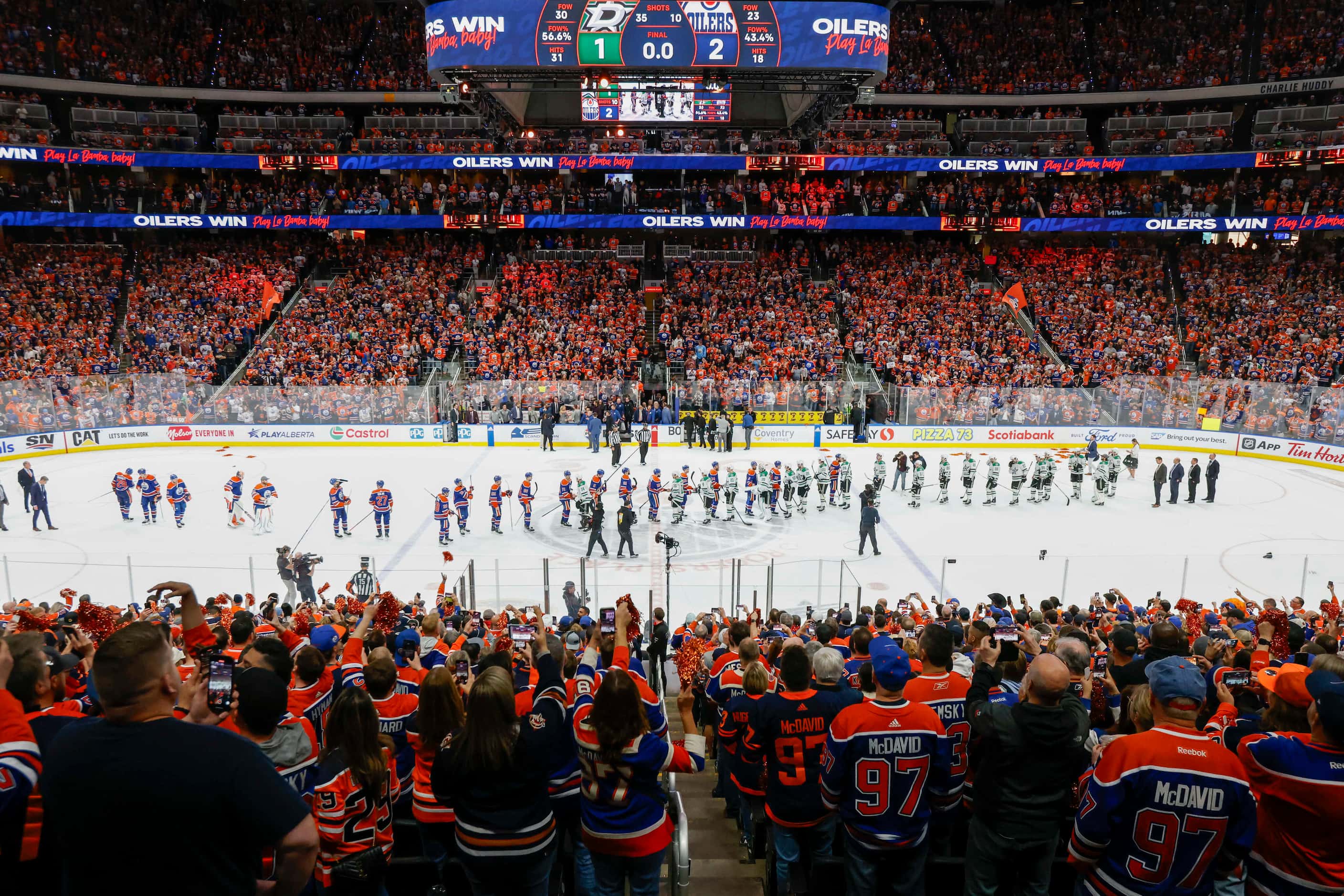 The Dallas Stars and the Edmonton Oilers shake hands after Game 6 of the Stanley Cup Western...