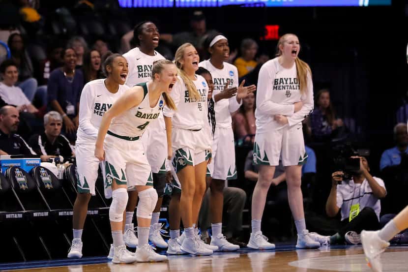 Baylor bench reacts during the second half of a regional final of the NCAA women's college...