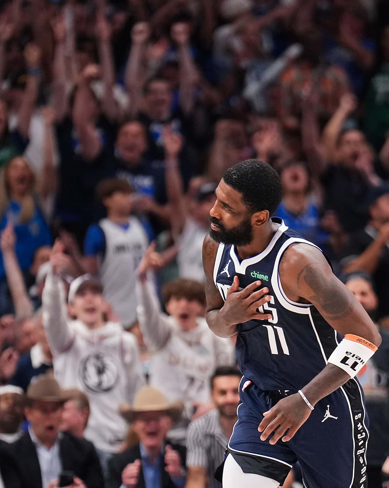 Dallas Mavericks guard Kyrie Irving (11) reacts after making a 3-pointer during the second...