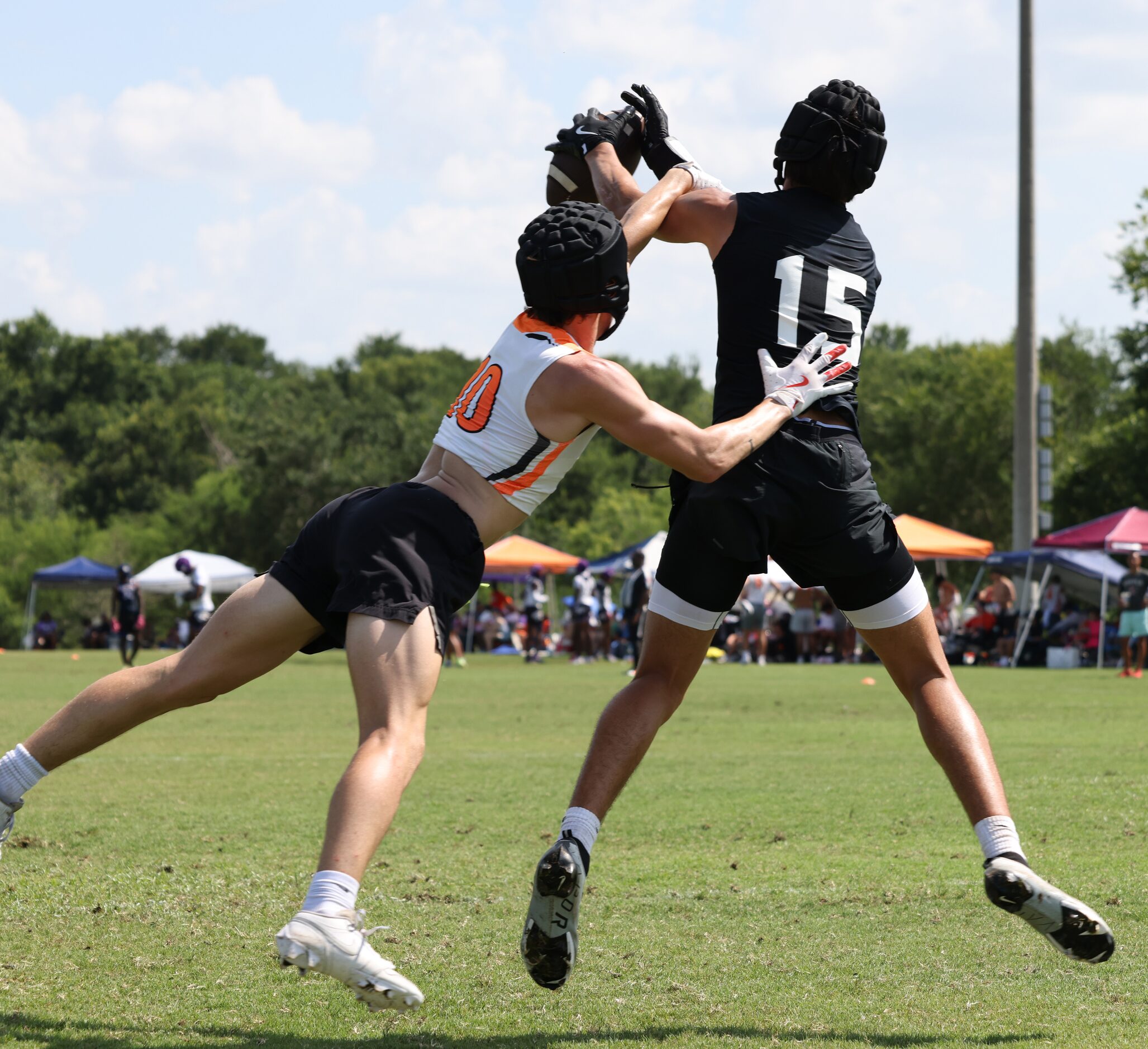 Argyle receiver Taniela O'Neal (15), right, reaches for a pass which is broken up as...