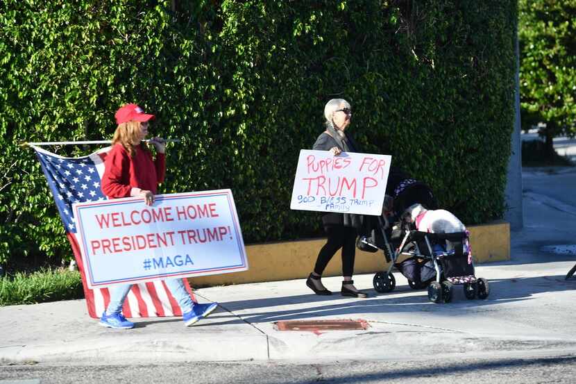 Supporters cheered Sunday as President Donald Trump traveled through West Palm Beach, Fla....