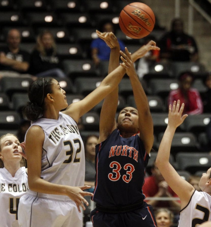 The Colony girls basketball player Jade Williams (32) blocks a shot by McKinney North's...