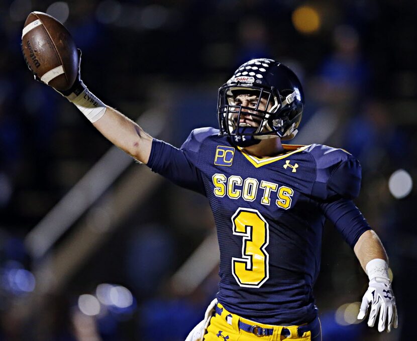 Highland Park receiver Chris Buell celebrates his touchdown during the first half against...