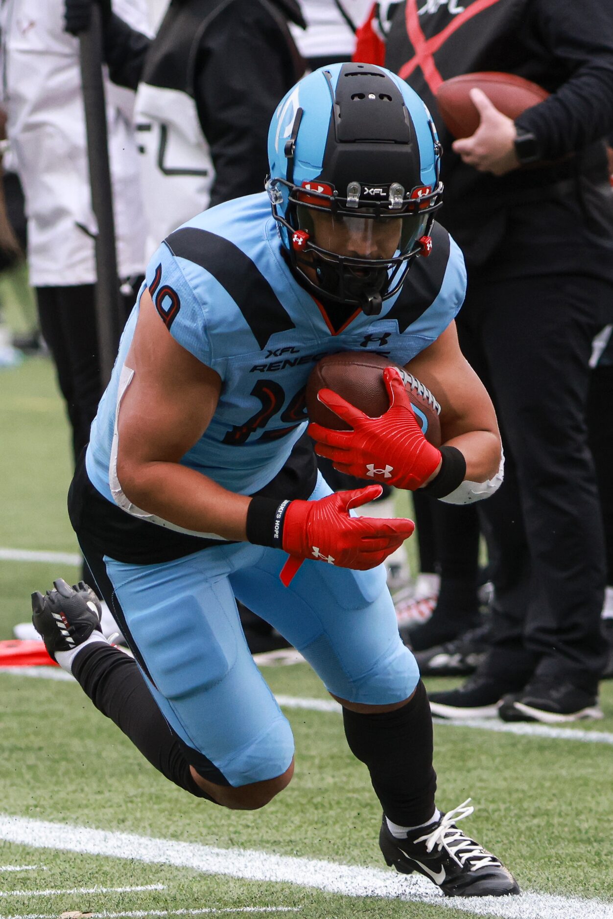 Arlington Renegades wide receiver Brandon Arconado (19) dives with the ball to gain yards up...