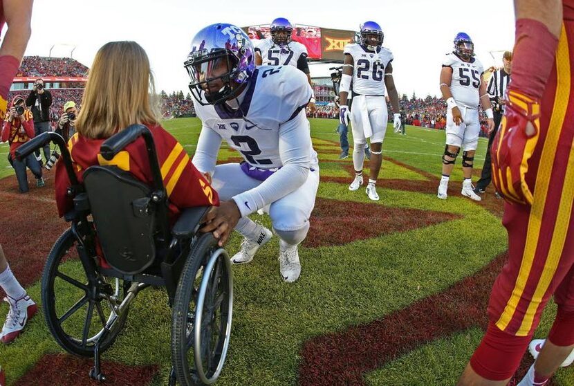 In this photo taken Saturday, Oct. 17, 2015, TCU quarterback Trevone Boykin (2) speaks with...