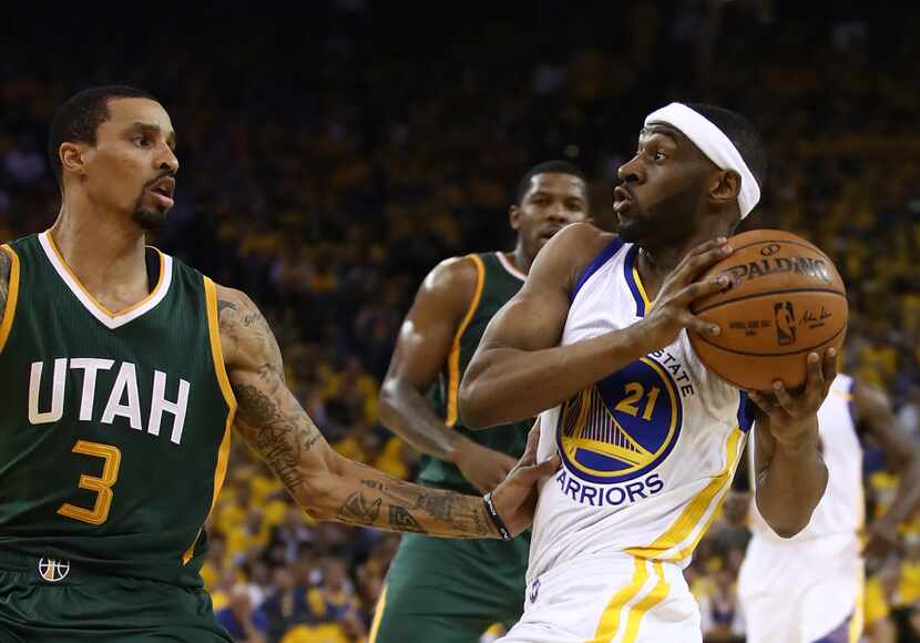 OAKLAND, CA - MAY 02:  Ian Clark #21 of the Golden State Warriors drives against George Hill...