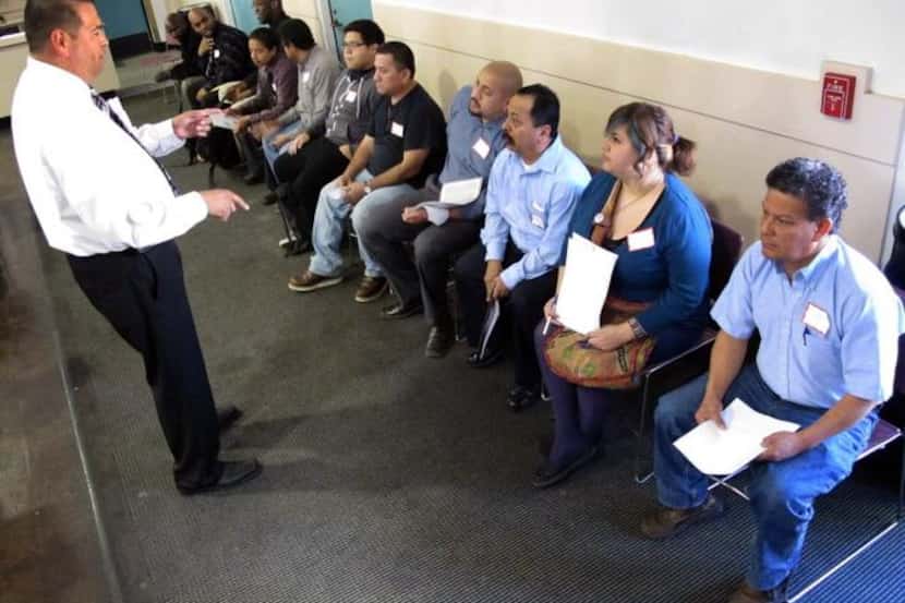 
People wait to interview at a job fair in Bell, Calif. Last year, the jobless rate for...