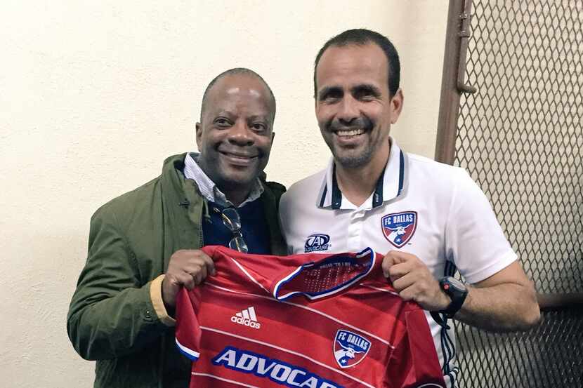 US Ambassador to Guatemala Todd D. Robinson is presented a jersey by FC Dallas head coach...