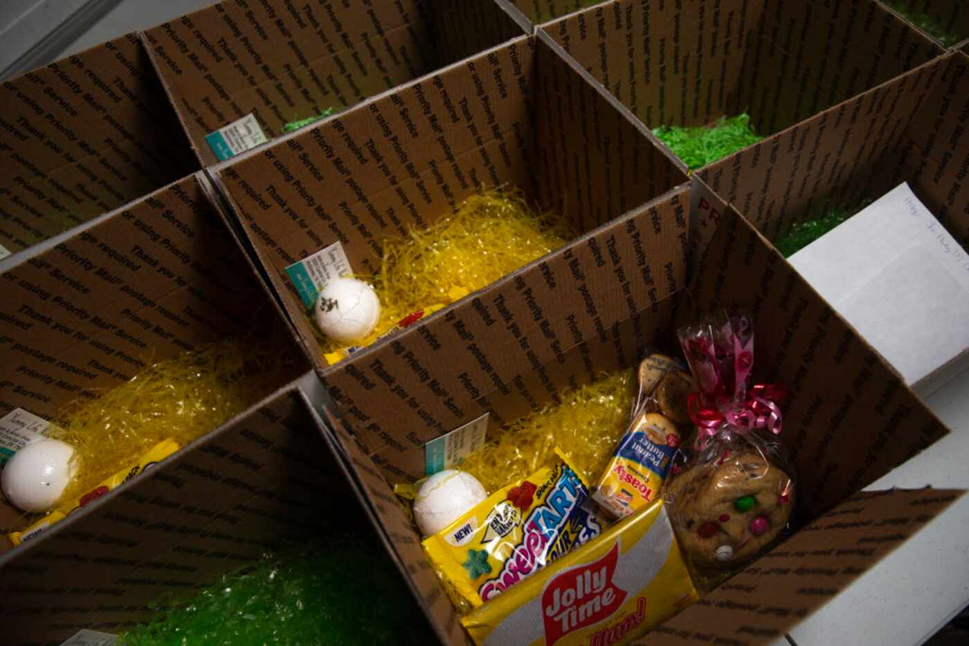 Care packages sit on a desk at Cookies in Bloom in McKinney. Cookies in Bloom is putting...