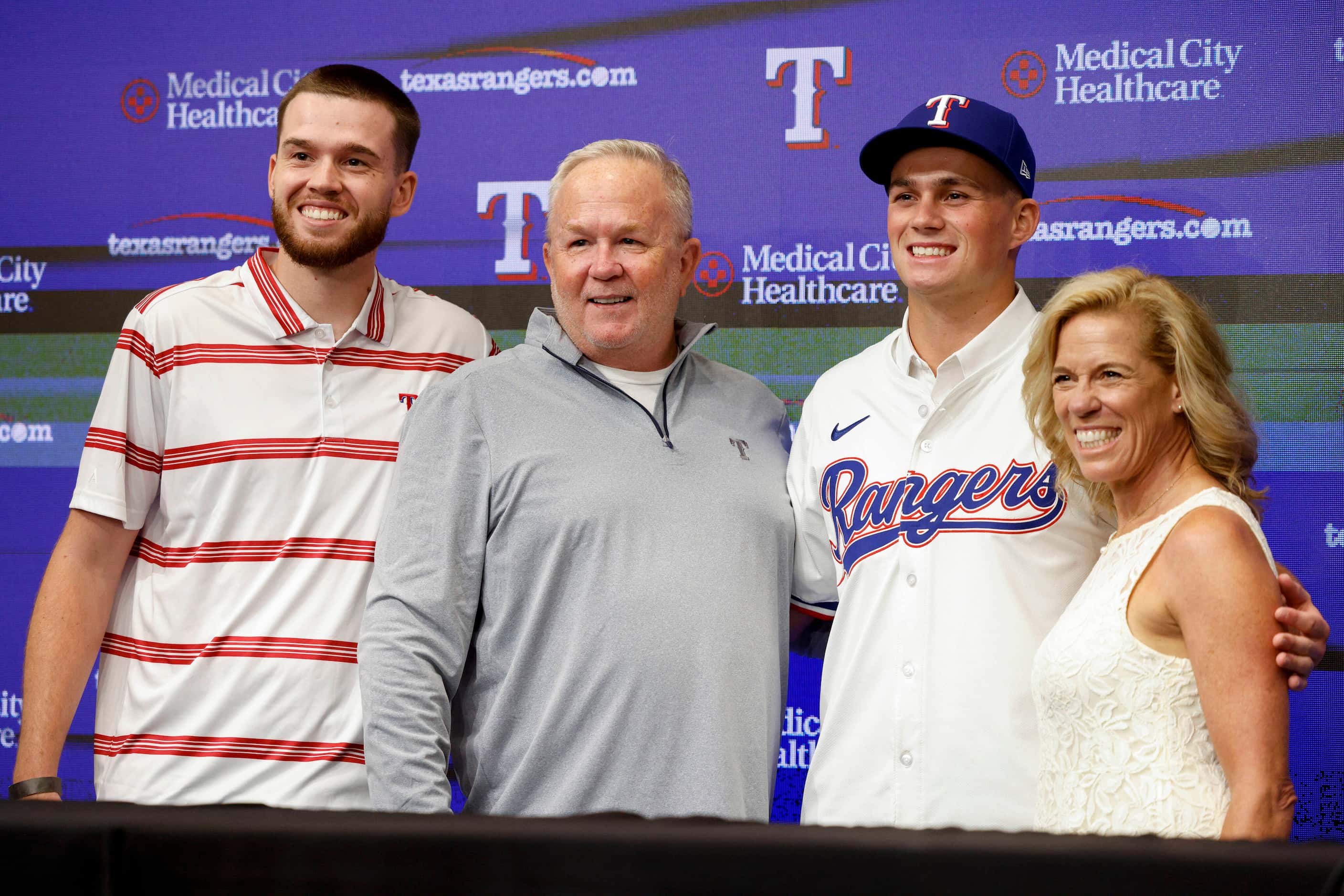 Texas Rangers first-round pick Malcolm Moore poses for photos with his brother Wilson Moore...