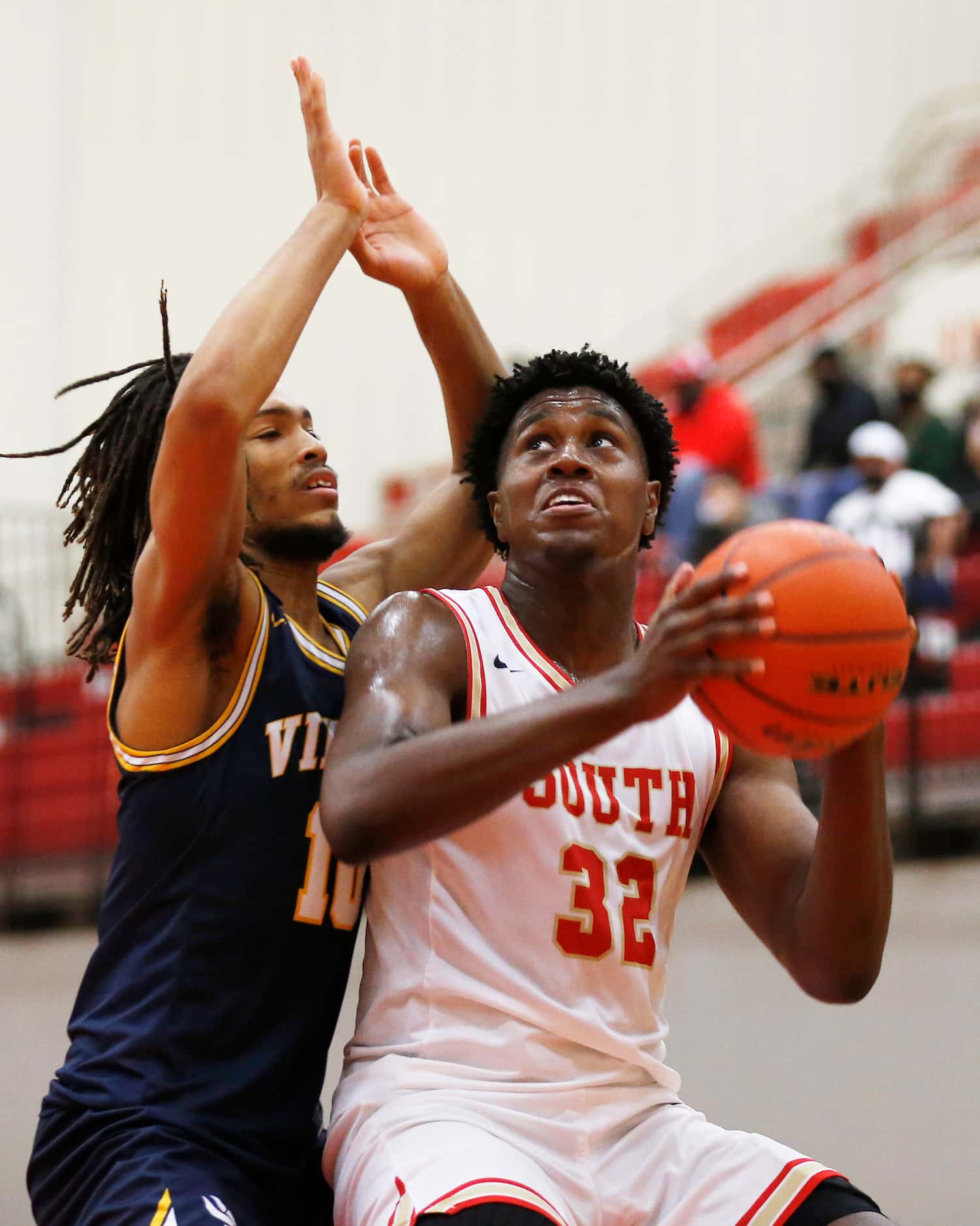South Grand Prairie's Terin Johnsonn (32) prepares to attempt a shot as he is defended by ...