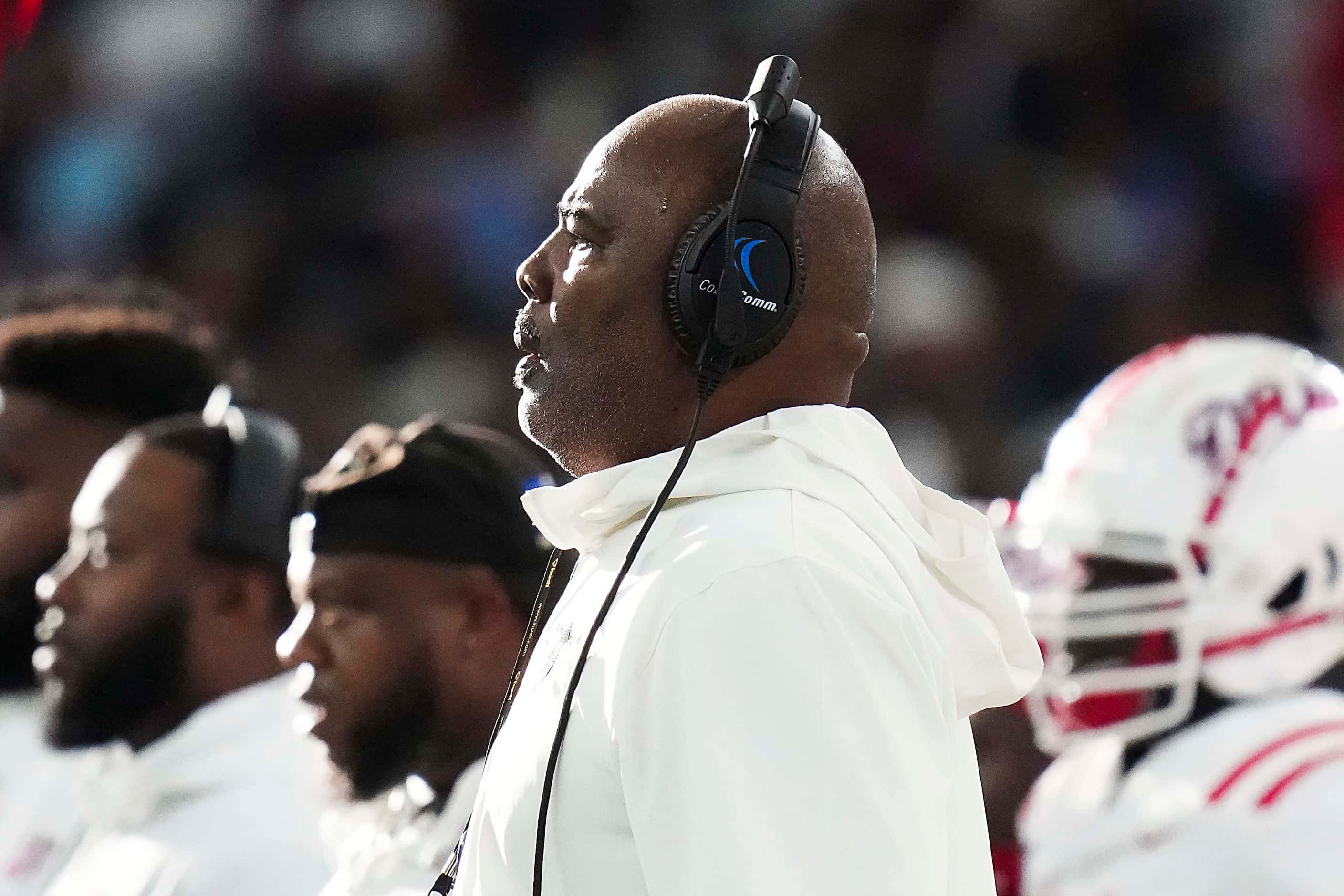 Duncanville head coach Reginald Samples looks on from the sidelines during the first half of...