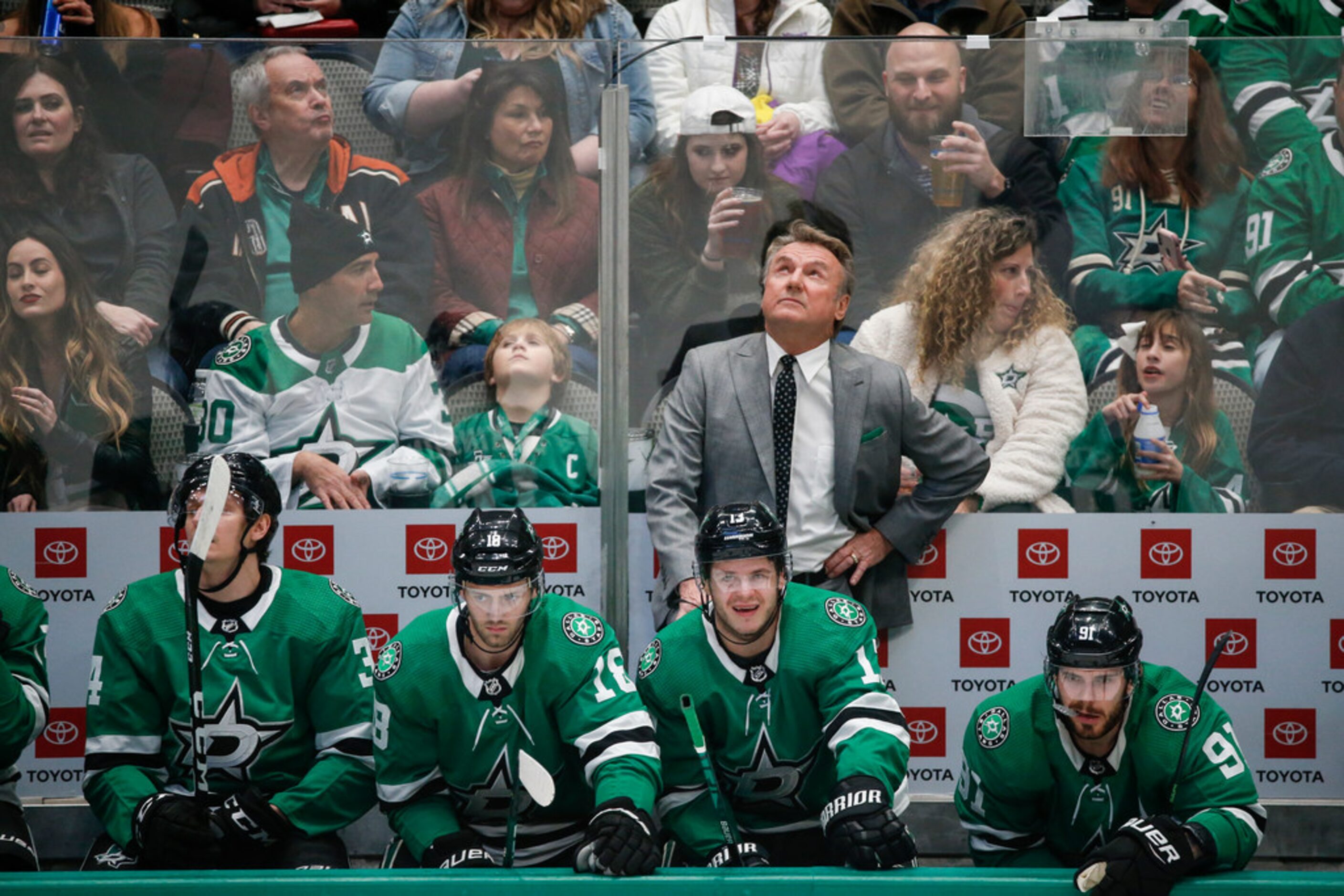 Dallas Stars interim head coach Rick Bowness works the bench during the first period of a...