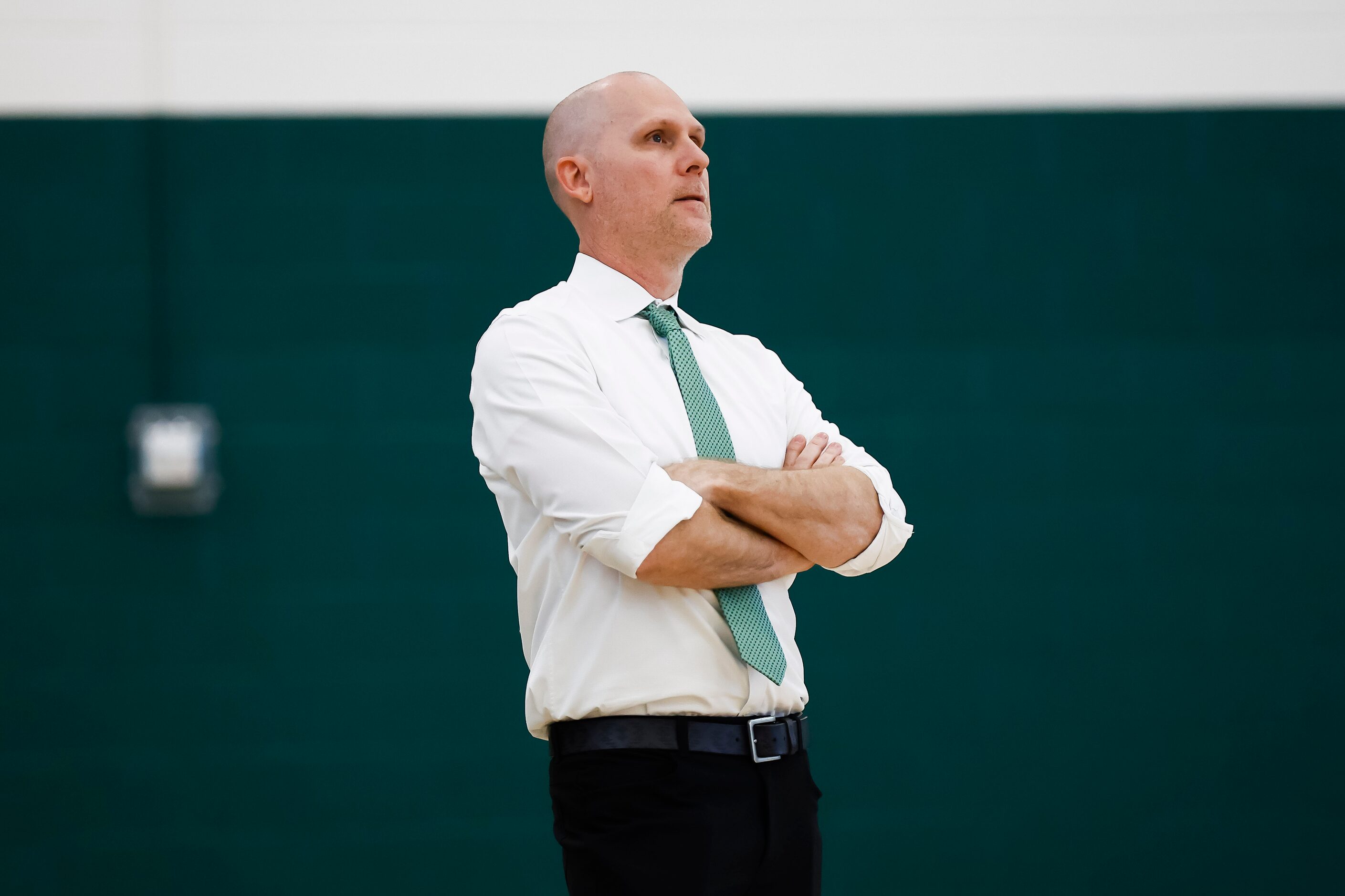 Hockaday volleyball coach Andy Gass looks on during a high school volleyball match against...