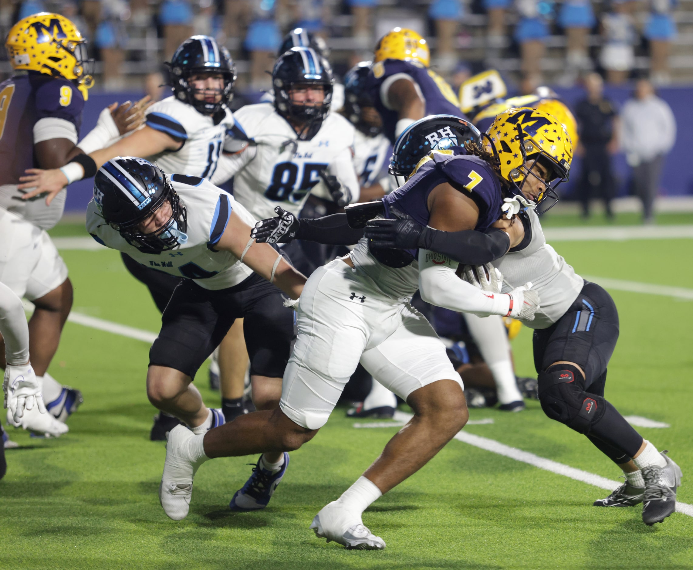 McKinney player #7 Riley Pettijohn is stopped by Rock Hill player #6 Nick Anderson during...