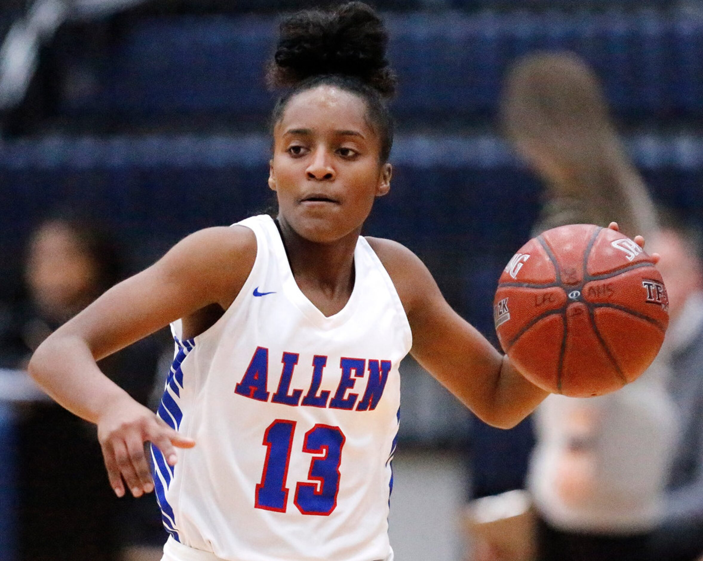 Allen High Schoolâs Zoe Jackson (13) bings the ball up the court during the first half as...