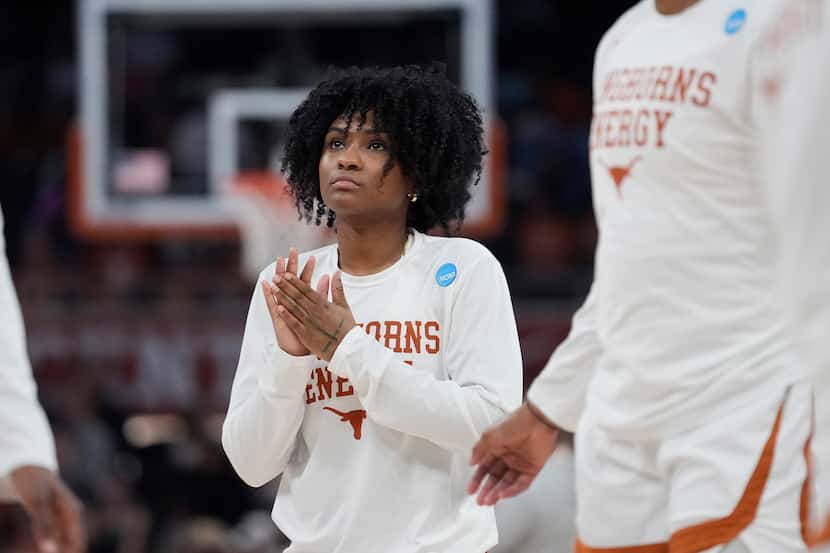 Texas guard Rori Harmon watches teammates warm up for a second-round college basketball game...