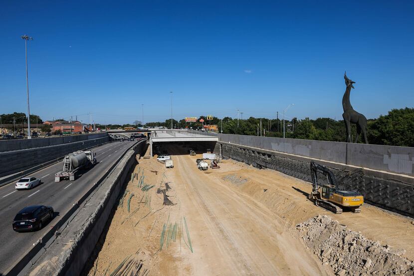 Construction of a deck park across I-35 at  Dallas Zoo in Dallas on Thursday, September 23,...