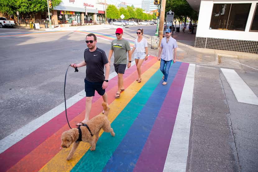 A group walks on a rainbow crosswalk on Cedar Springs and Throckmorton Street in Oak Lawn on...