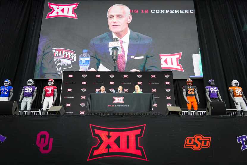 From left, outgoing Big 12 commissioner Bob Bowlsby, incoming commissioner Brett Yormark and...