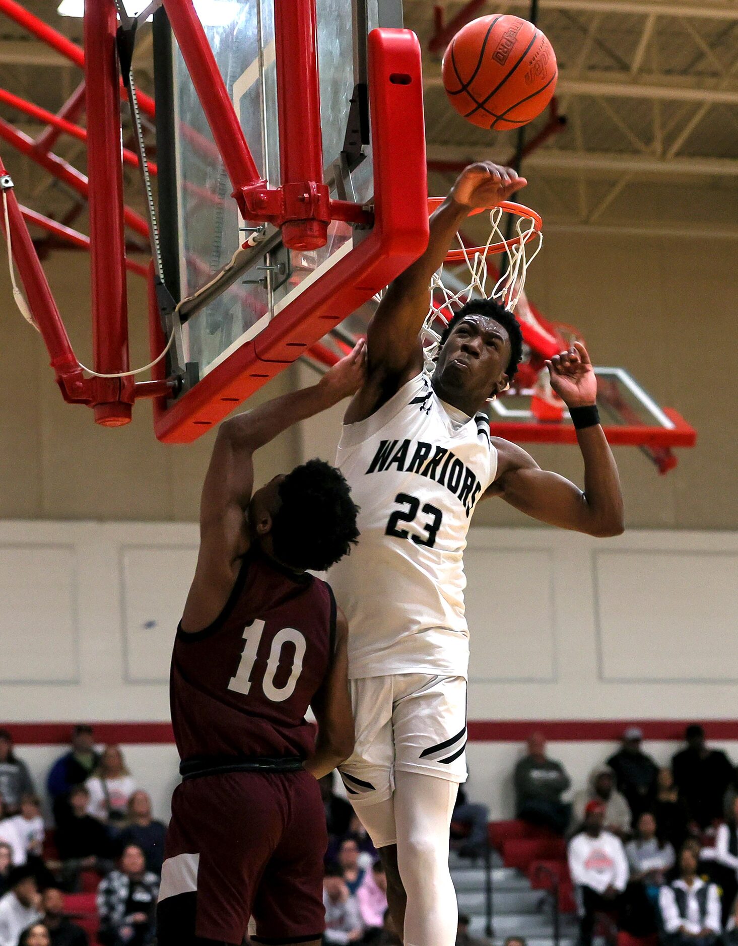 Arlington Martin guard Kordelius Jefferson (23) blocks a shot from Lewisville guard...