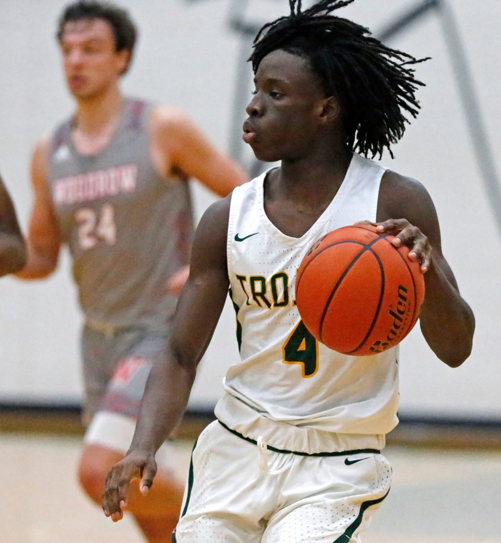 Newman Smith High School guard Jeremy Obriki (4) brings the ball down the court during the...