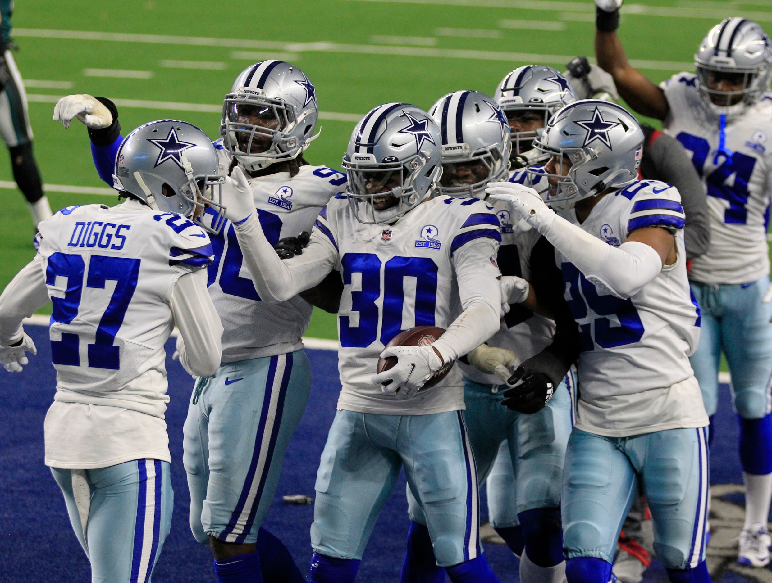 Dallas Cowboys cornerback Anthony Brown (30) and teammates celebrate his interception in the...